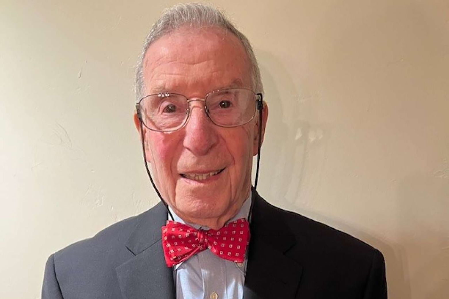 Head-and-shoulders photo of Stephen Cederbaum wearing gray jacket, red bow tie and glasses