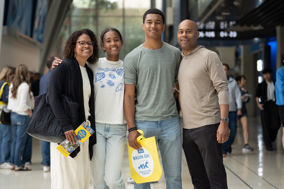 Bruin Day–A prospective student and three family members pose in the hallway at Pauley Pavilion