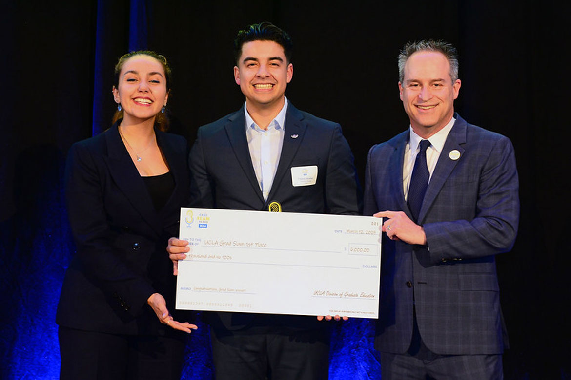 L-R: Noor Nakhaei, president of the Graduate Student Association, Grad Slam champion Pablo Alvarez, and Dean and Vice Provost of Graduate Education Brian Kite. Alvarez is holding an oversized check.
