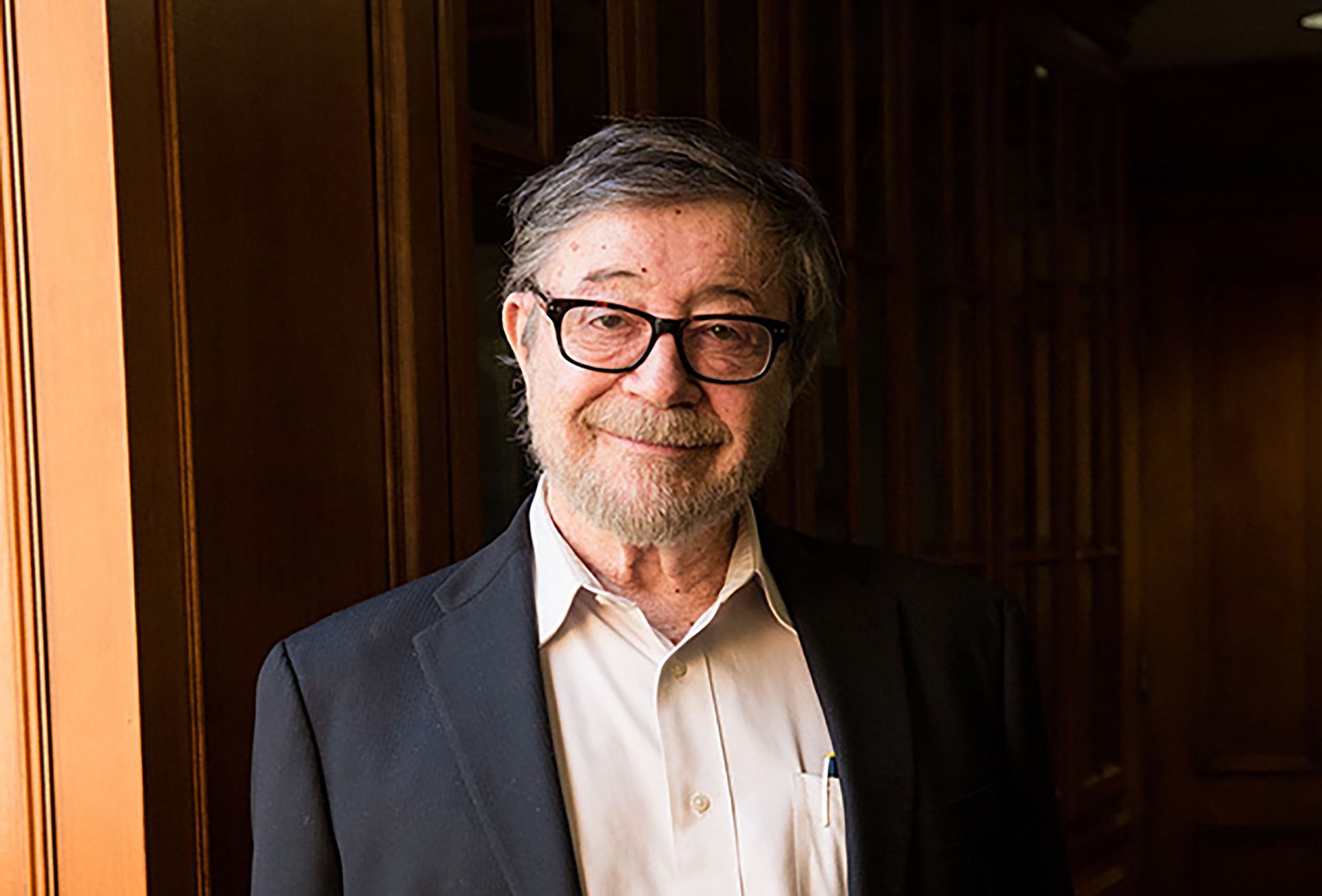 Head-and-shoulders photo of Judea Pearl in beige button-down, black jacket and glasses