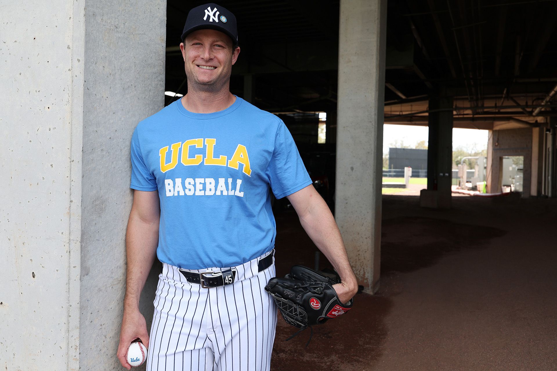 Gerrit Cole sports a UCLA baseball T-shirt with his Yankees cap
