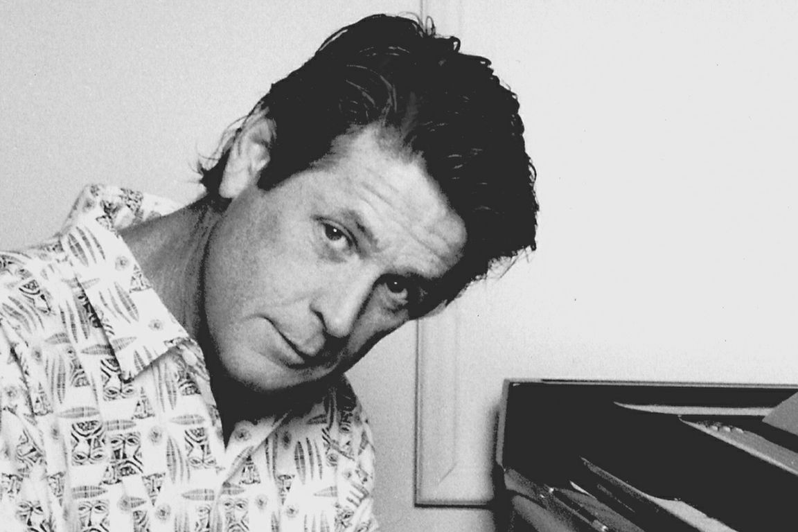 Brian Wilson—black-and-white photo of Wilson seated at piano