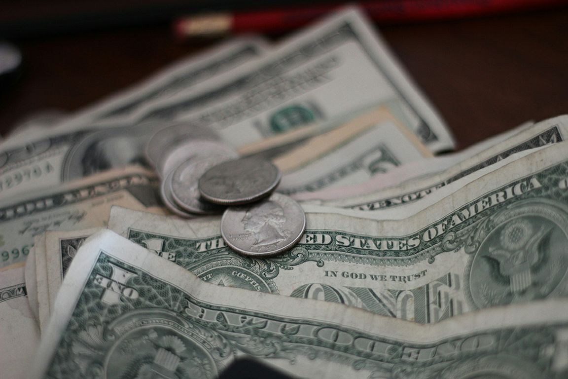 Coins on top of dollars