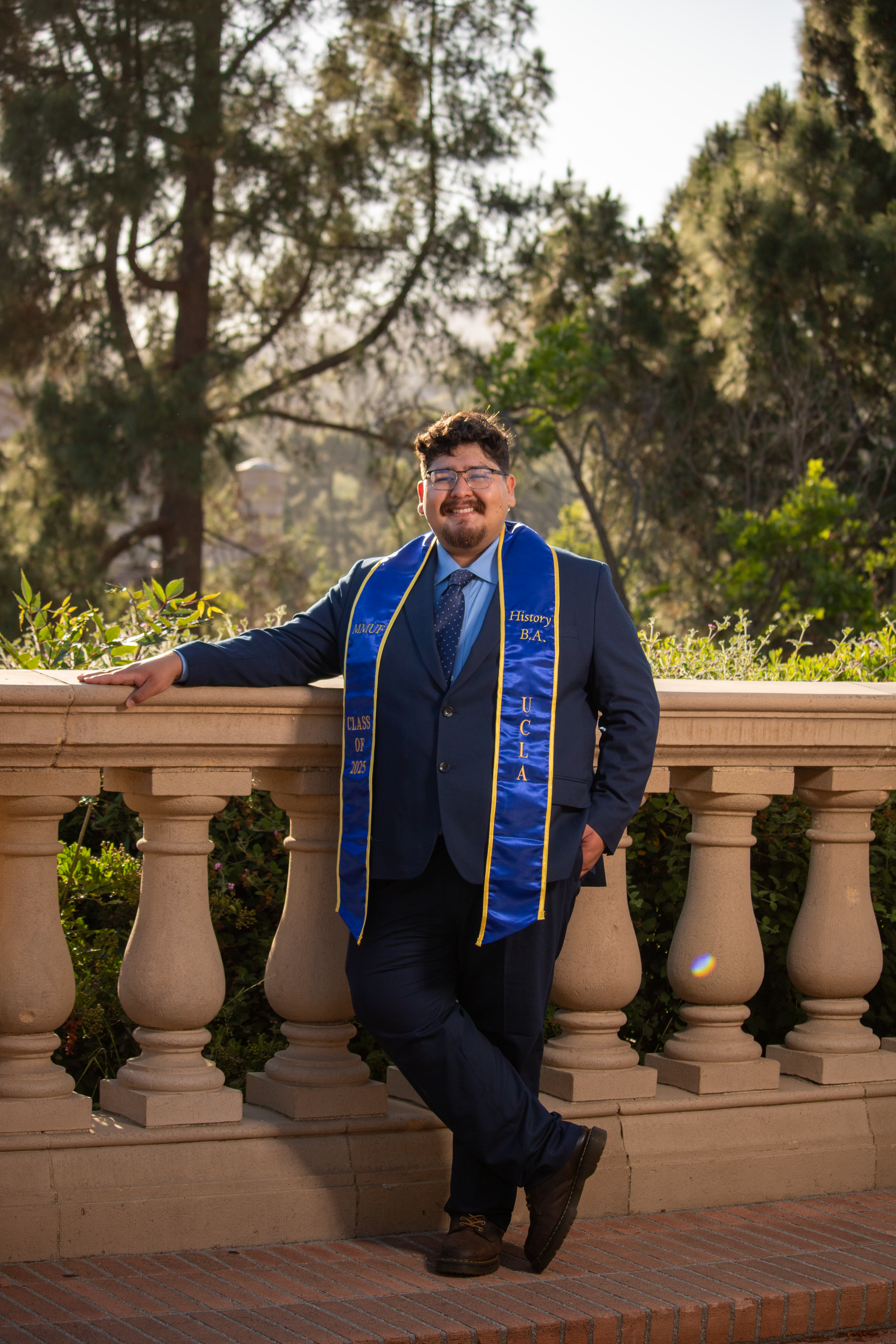 UCLA history student Guillermo Miranda graduation photo with sash