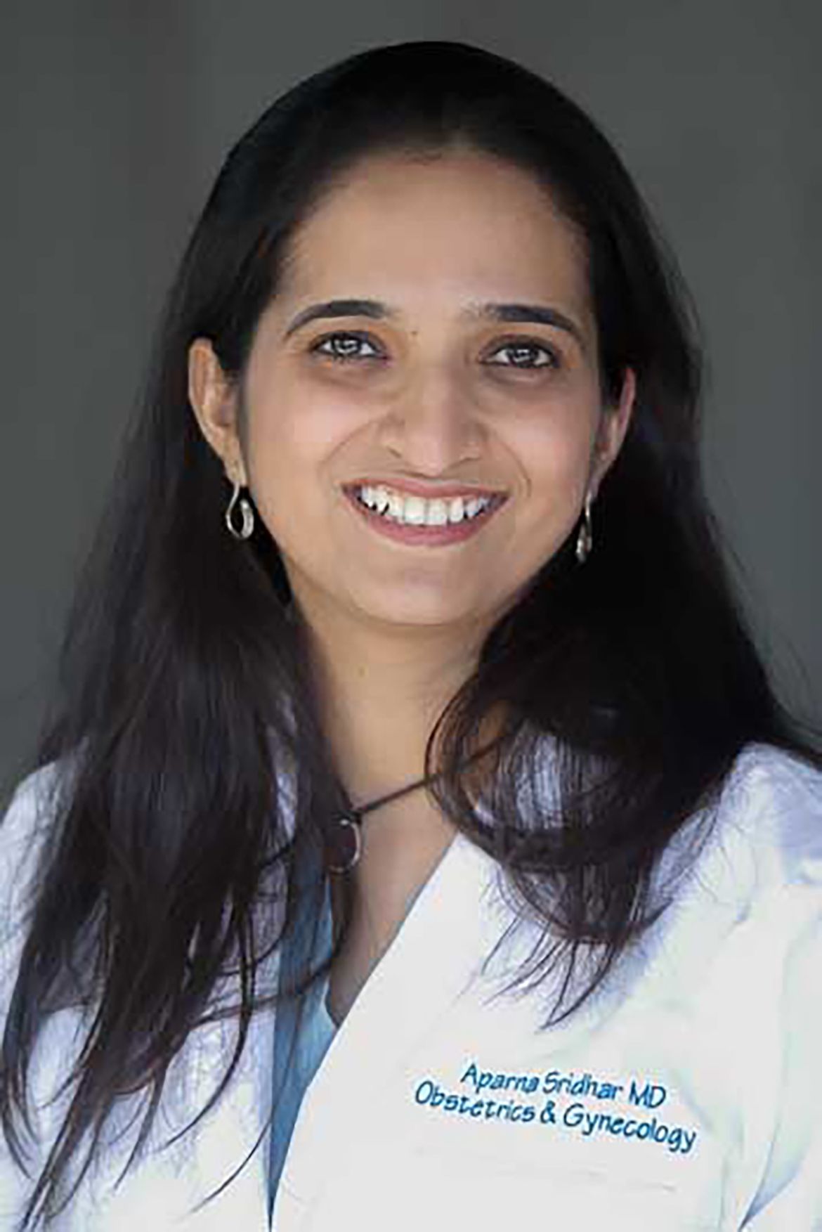 Aparna Sridhar in white coat