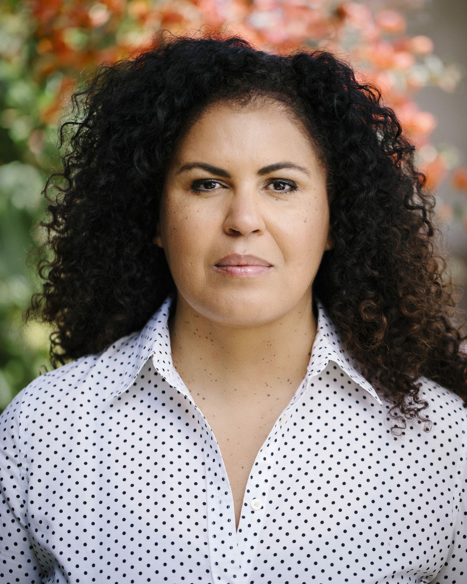Safiya Noble in white top with black polka dots