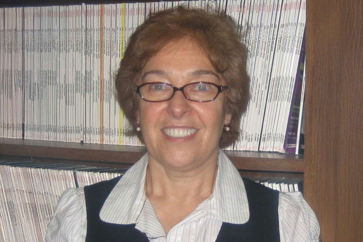 Head-and-shoulders photo of Anna Gukovskaya in front of a bookshelf