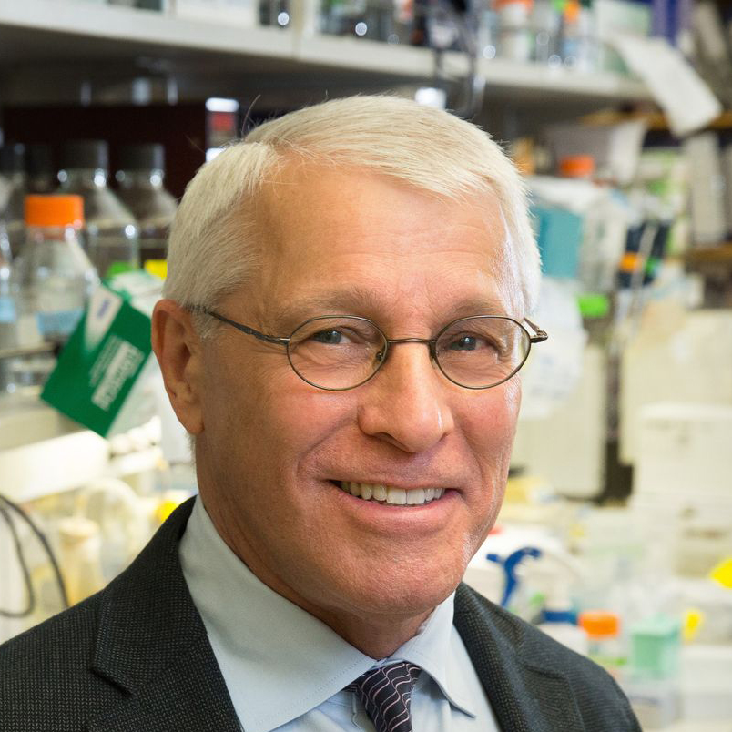 Close-up of Owen Witte wearing glasses in the lab