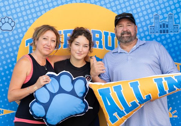 Move-in: Student and parents pose in front of UCLA sign