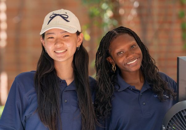 Move in: Two UCLA Housing volunteers smiling