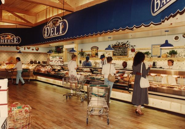 Four customers at the deli counter inside a Mrs. Gooch’s Natural Food Store