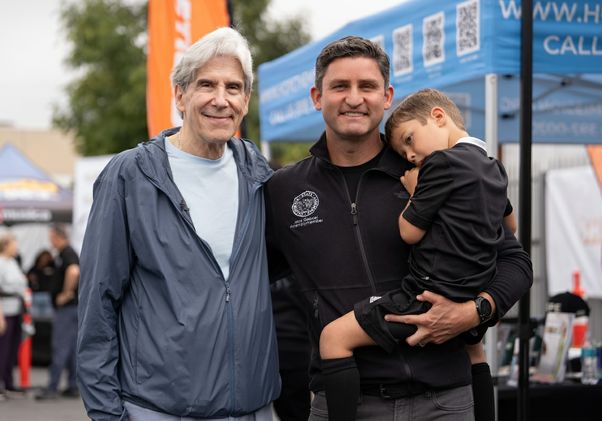 VolunteerFrenk with man and child
