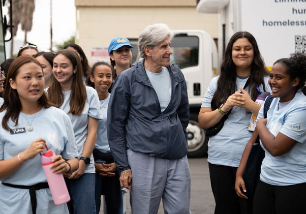 VolunteerFrenk with students at Hope the Mission
