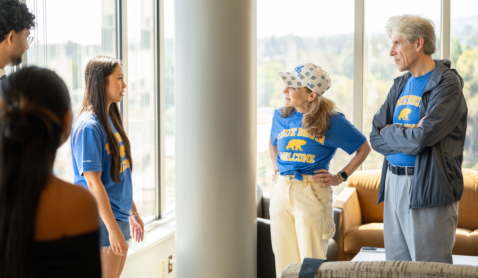 Move-inFrenk and Knaul speaking with students in apartment