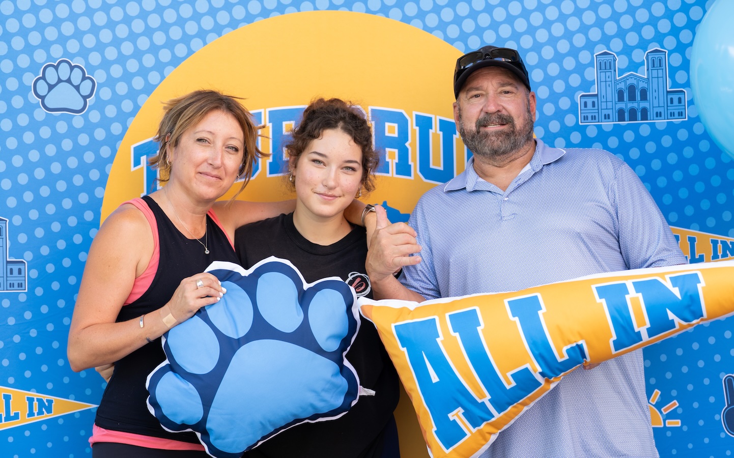 Move-in: Student and parents pose in front of UCLA sign