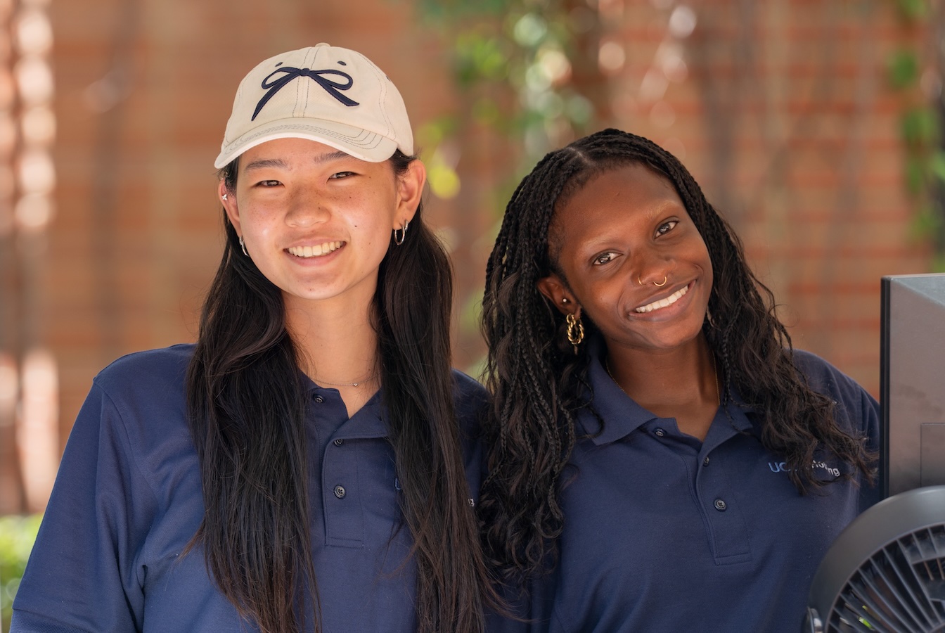Move in: Two UCLA Housing volunteers smiling