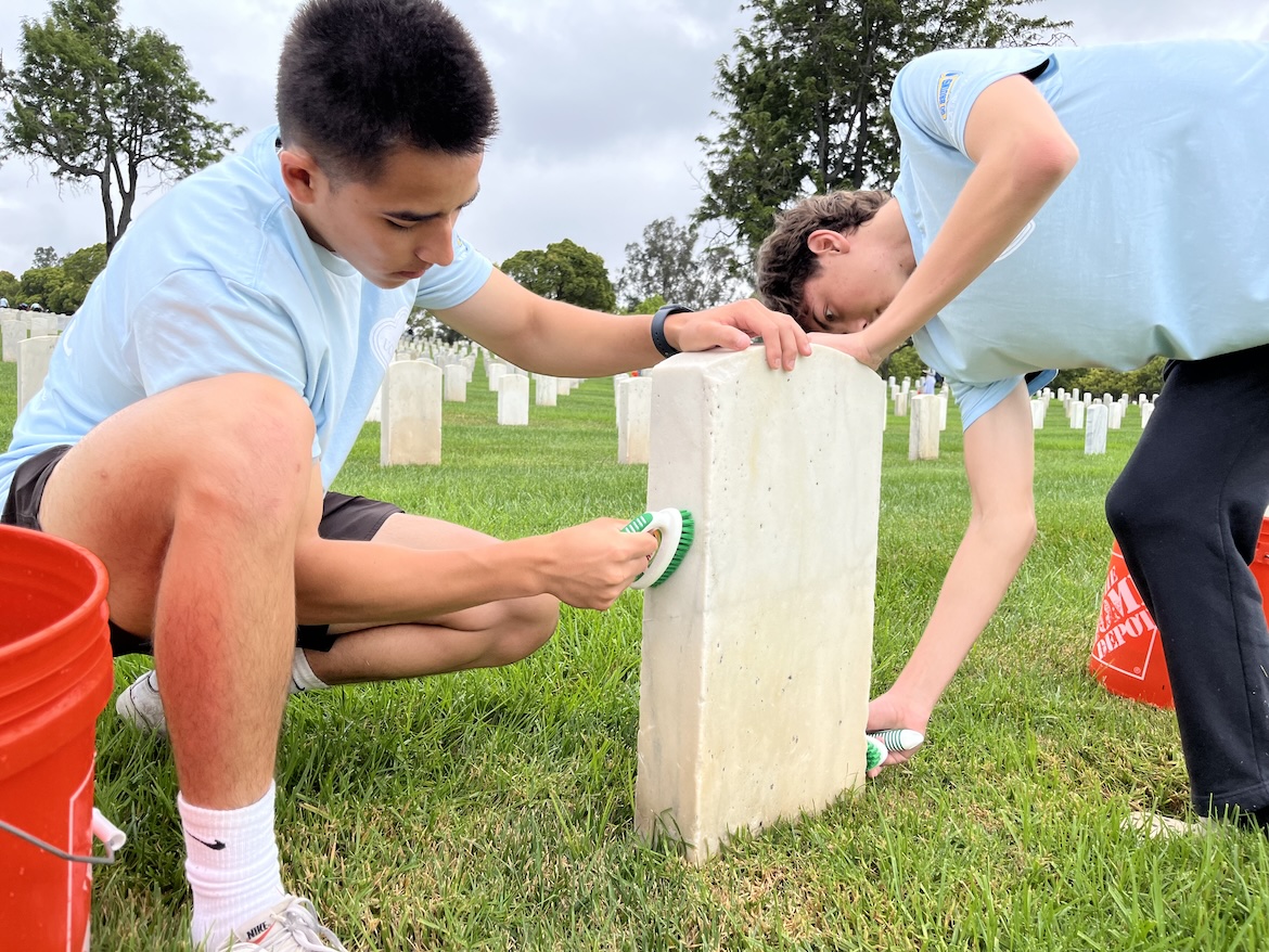Volunteer-Students washing headstones