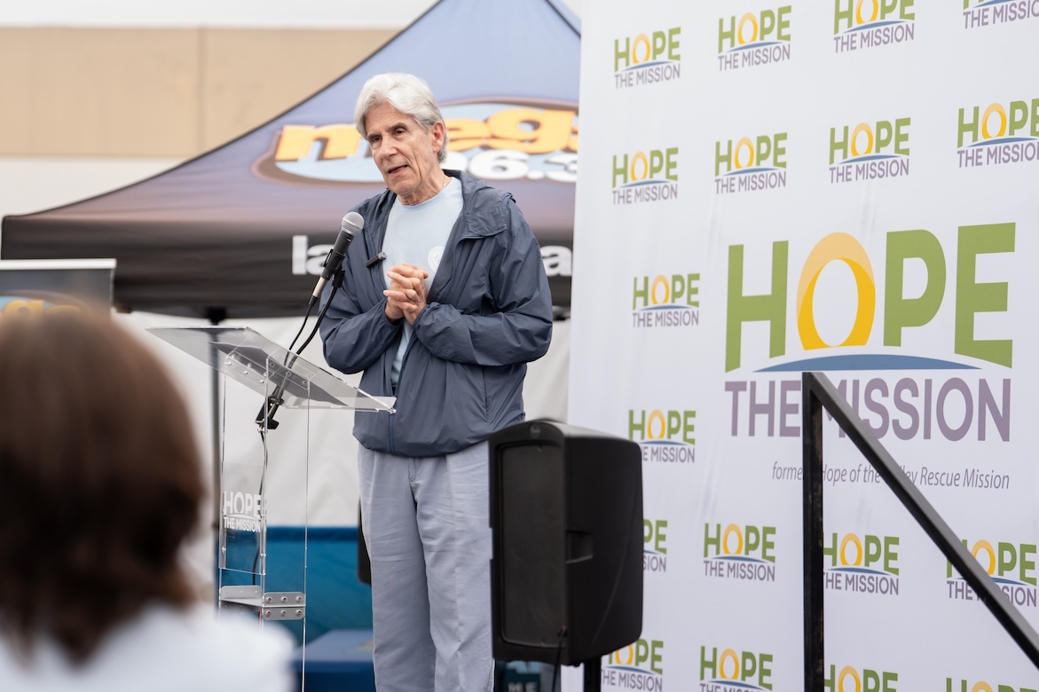 VolunteerFrenk on stage at Hope the Mission