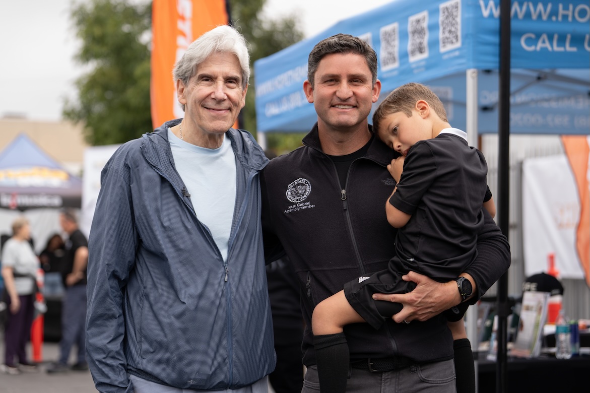 VolunteerFrenk with man and child