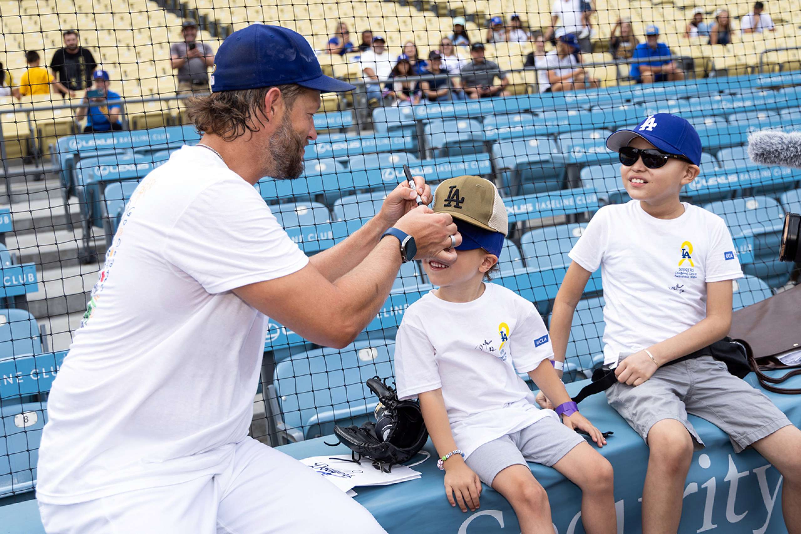 Clayton Kershaw visits with Jacob Kozhevnikov.