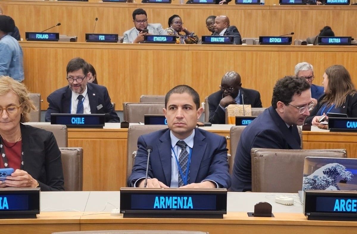  Dr. Shant Shekherdimian sits behind Armenia placard at the United Nations’ Assembly Hall