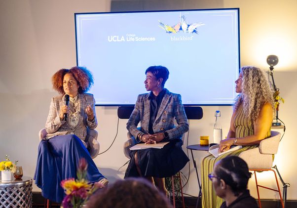Three women — Coulter Cheadle, Johnson, and Poe — seated in a panel discussion setting at the inaugural installment of the event series "Breaking Barriers: Conversations on Leading Change in Science, Advocacy and Storytelling."