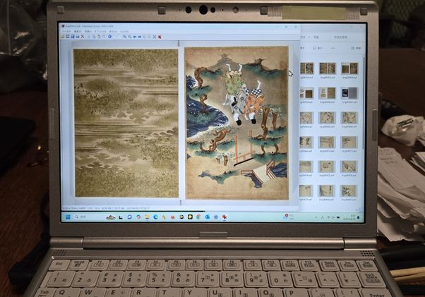 Two upside-down book illustrations on a laptop screen; tree-filled landscape shot on left and three people walking on right