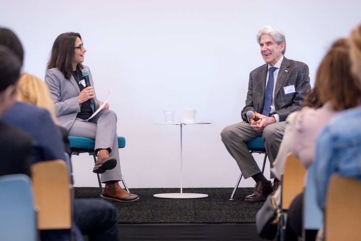 Chancellor Julio Frenk and Christina Christie, dean of the UCLA School of Education and Information Studies, seated facing each other with microphones during a candid discussion at the Geffen Academy.