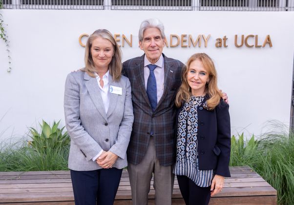 Sibyll Carnochan Catalan, Chancellor Julio Frenk and Felicia Knaul posing together in front of the Geffen Academy at UCLA sign.