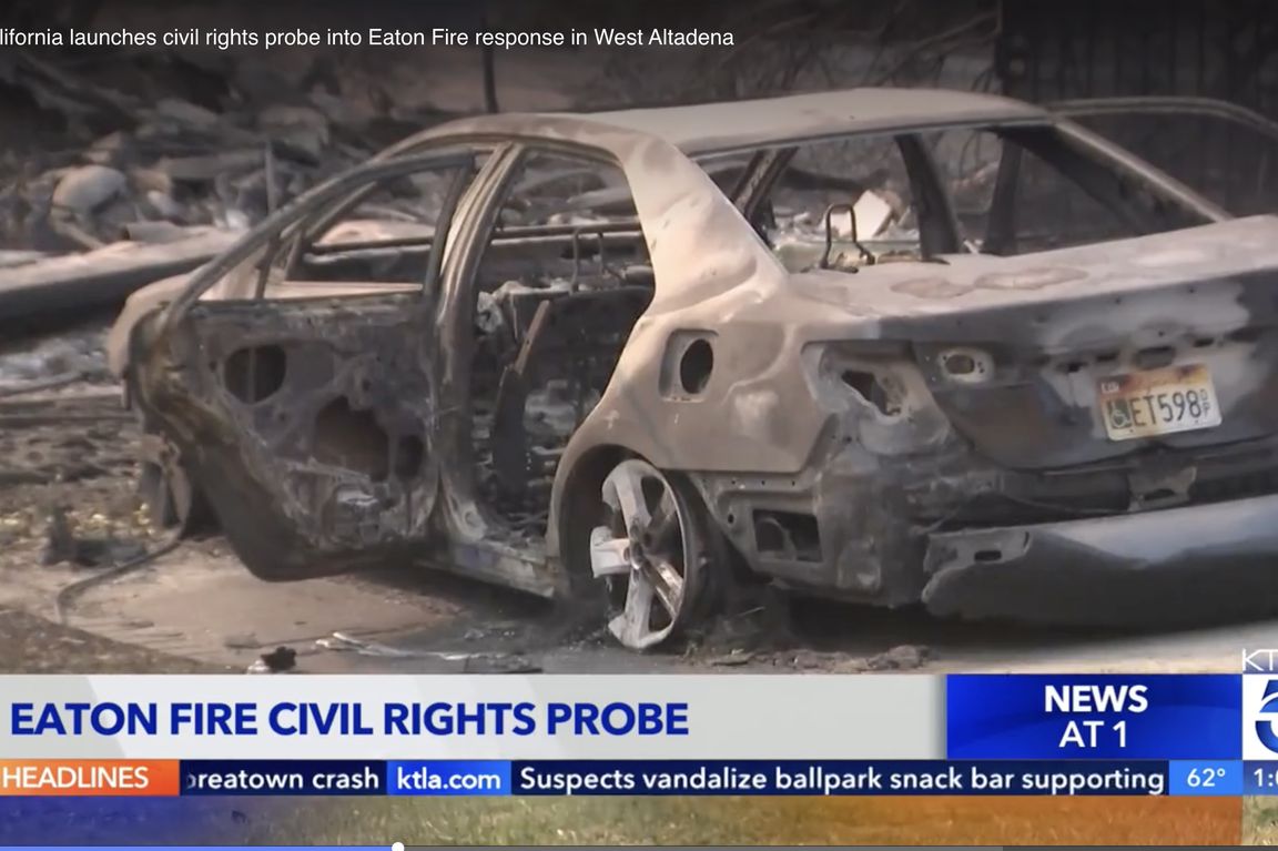 A burned-out car amid fire destruction in a KTLA news segment about the Eaton Fire civil rights probe in West Altadena."