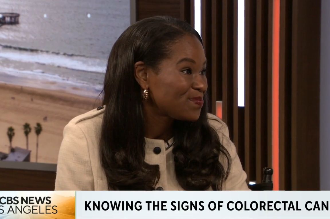 UCLA gastroenterologist Dr. Fola May speaking on a television news segment about knowing the signs of colorectal cancer.