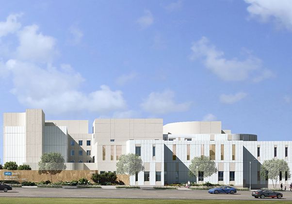 An architectural rendering of the proposed UCLA Health neuropsychiatric hospital and comprehensive mental health campus, showing a modern multi-story building with light-colored stone and glass facades surrounded by trees under a blue sky.