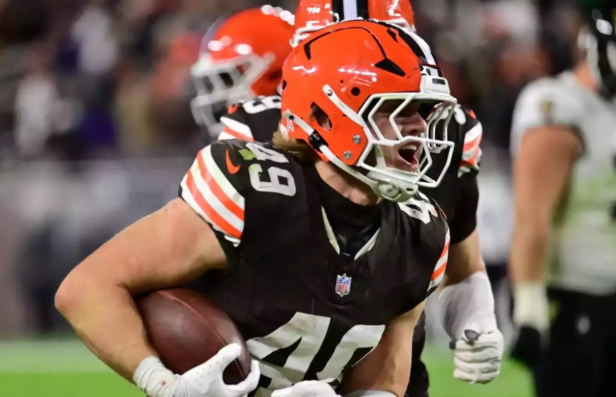 Cleveland Browns linebacker Carson Schewsinger celebrating with the football during an NFL game.