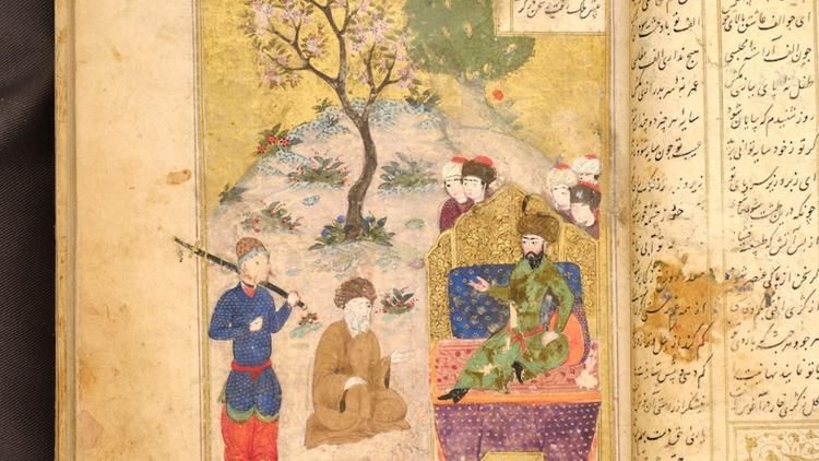 An illuminated manuscript page from UCLA's collection features a detailed miniature painting of robed figures gathered beneath a flowering tree, accompanied by columns of Arabic-script text.