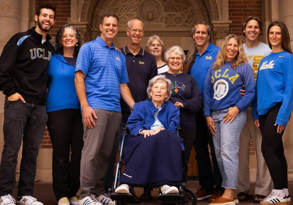 An extraordinary portrait on the UCLA campus of 11 members of the Wallis family, representing UCLA alumni from across four generations: Marilyn Heinmiller, the matriarch, sits in a wheelchair in front.
