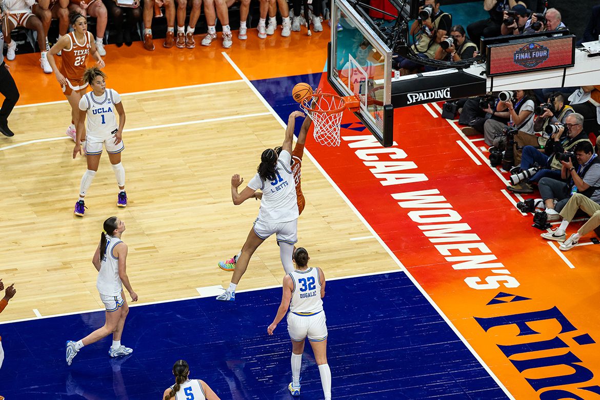UCLA's Lauren Betts (51) swats away a Texas shot attempt at the basket during the Bruins' Final Four victory in Phoenix.