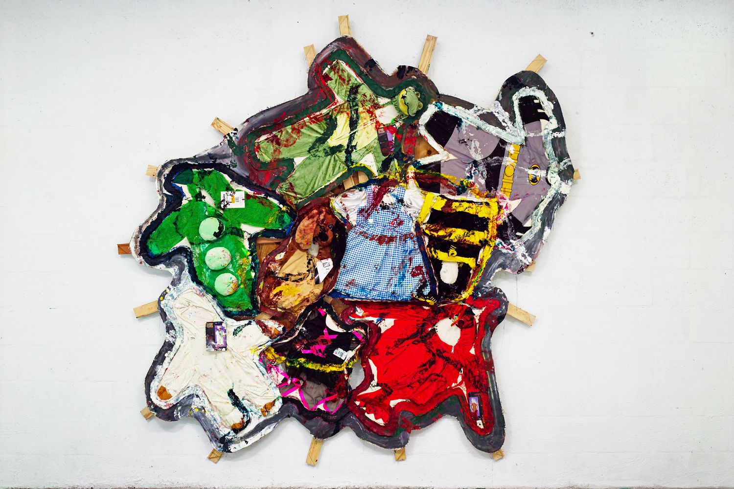 Collage of people-shaped cutouts in various colors and outfits