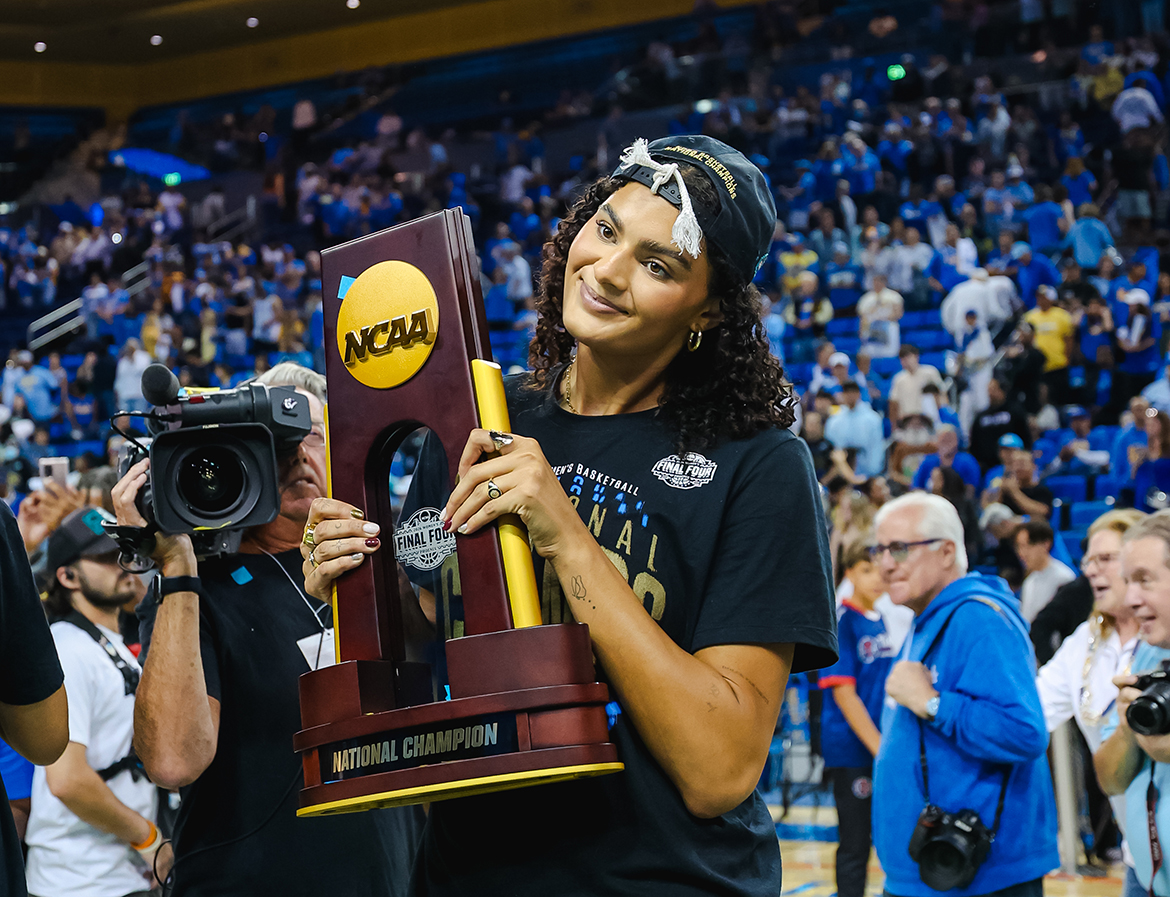Lauren Betts hold the NCAA National Championship trophy at the Pauley Pavilion celebration, April 8, 2026