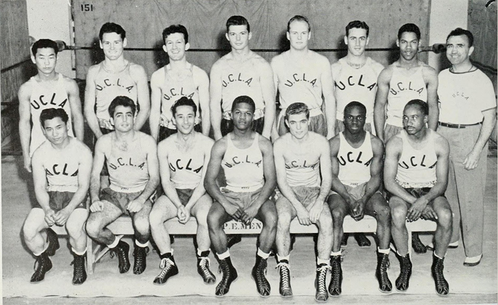 Black-and-white photo of UCLA boxing team; seven seated in front row and eight standing in back row