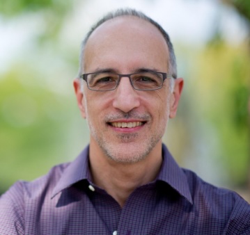 Close shot of Martin Gilens in purple collared shirt.