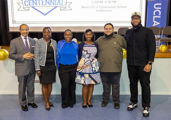 A panel of Mann alumni from across the years features six alumni standing side by side with “Centennial” banner in the background. 