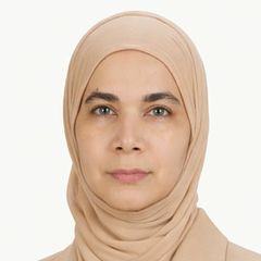 Syeda Rehman, wearing a light beige hijab, looking directly at the camera against a plain white background.