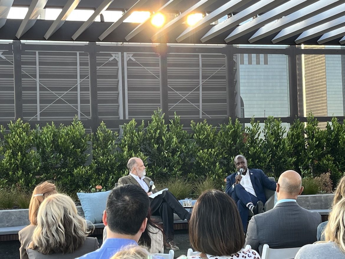 UCLA's Jim Newton interviews Los Angeles City Council President Marqueece Harris-Dawson before an audience on the rooftop of UCLA Downtown during Blueprint magazine's 10th anniversary event.