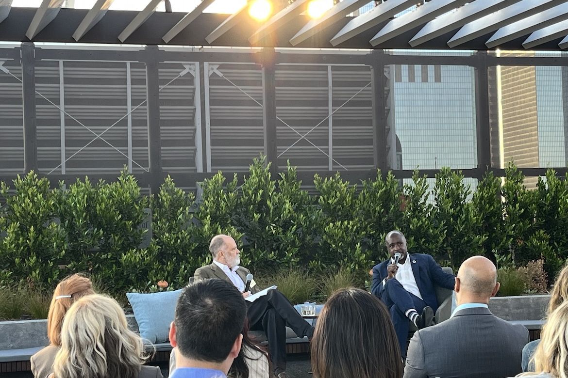 UCLA's Jim Newton interviews Los Angeles City Council President Marqueece Harris-Dawson before an audience on the rooftop of UCLA Downtown during Blueprint magazine's 10th anniversary event.