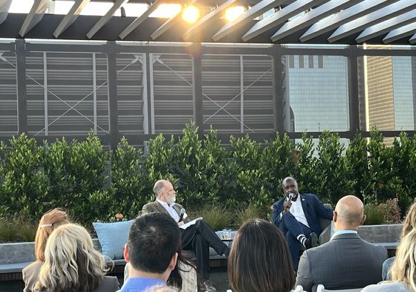 UCLA's Jim Newton interviews Los Angeles City Council President Marqueece Harris-Dawson before an audience on the rooftop of UCLA Downtown during Blueprint magazine's 10th anniversary event.