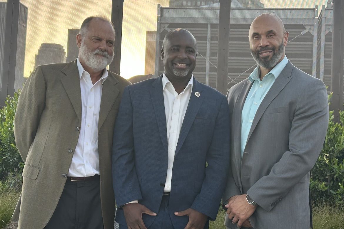 From left, Jim Newton, Los Angeles City Council President Marqueece Harris-Dawson and UCLA Executive Vice Chancellor and Provost Darnell Hunt pose together on the rooftop of UCLA Downtown.