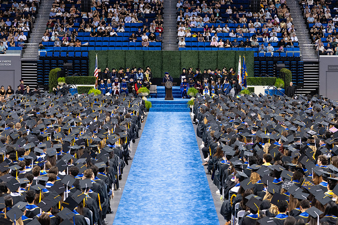 A wide view of UCLA's 2026 commencement ceremony inside a packed Pauley Pavilion.