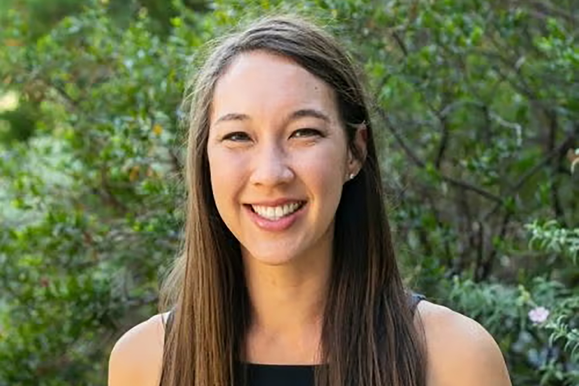 Head-and-shoulders photo of Kristen Choi wearing black tank top. Trees in the background.