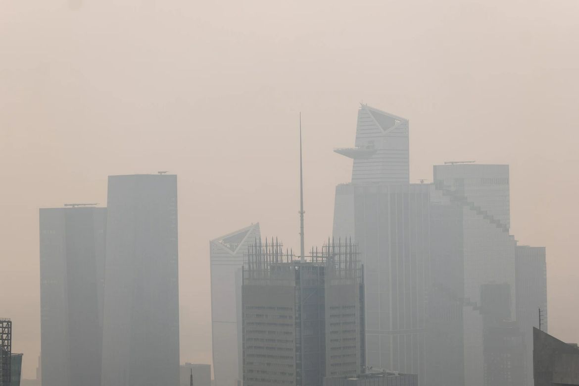 Haze from Canadian wildfires blankets the Manhattan skyline as seen from the Top of the Rock Observation Deck on July 16, 2026 in New York City.