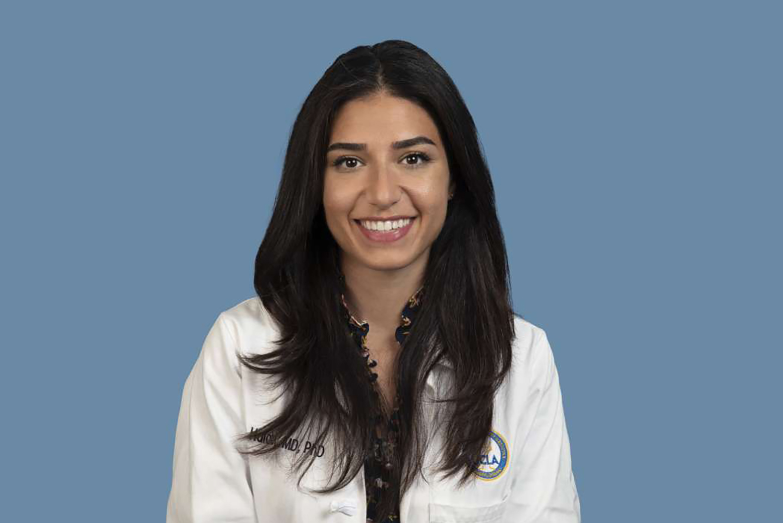 Head-and-shoulders photo of Anasheh Halabi in white coat against blue background.